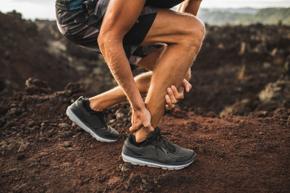 Achilles tendonitis causing pain and stiffness at the back of the heel